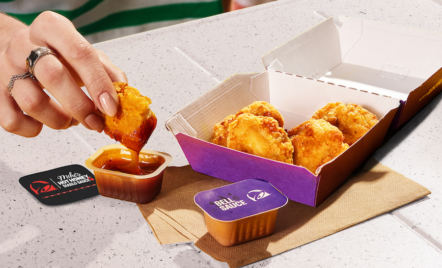 taco bell nuggets being dipped into mikes hot honey diablo sauce