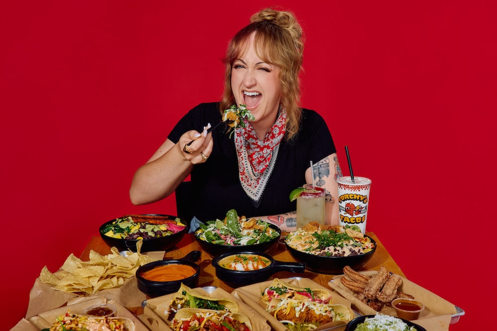 brittny broski eats torchys taco bowls with red background